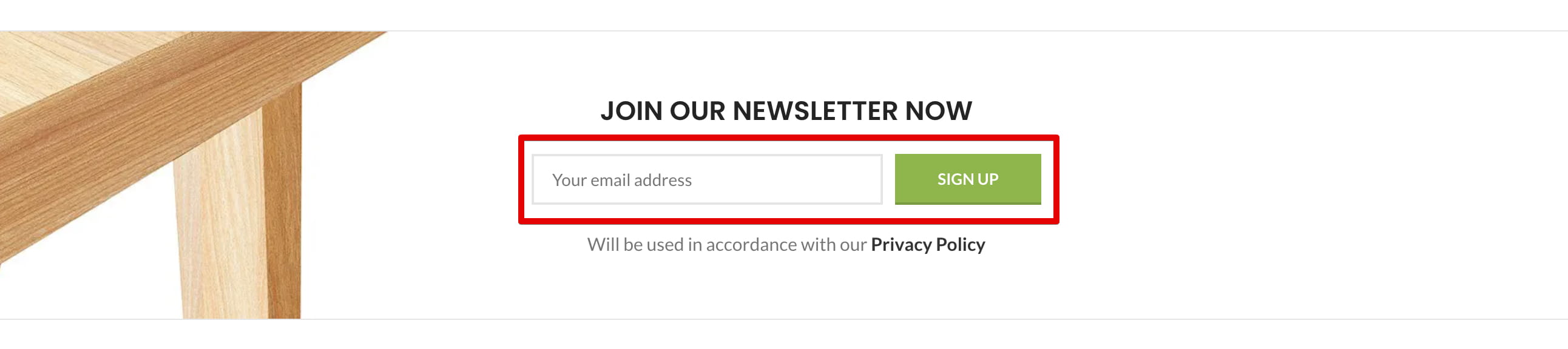 Newsletter signup form with an email address field and Sign Up button